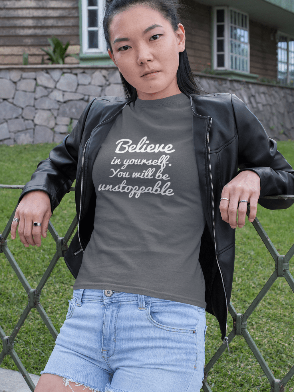 woman leaning on a fence